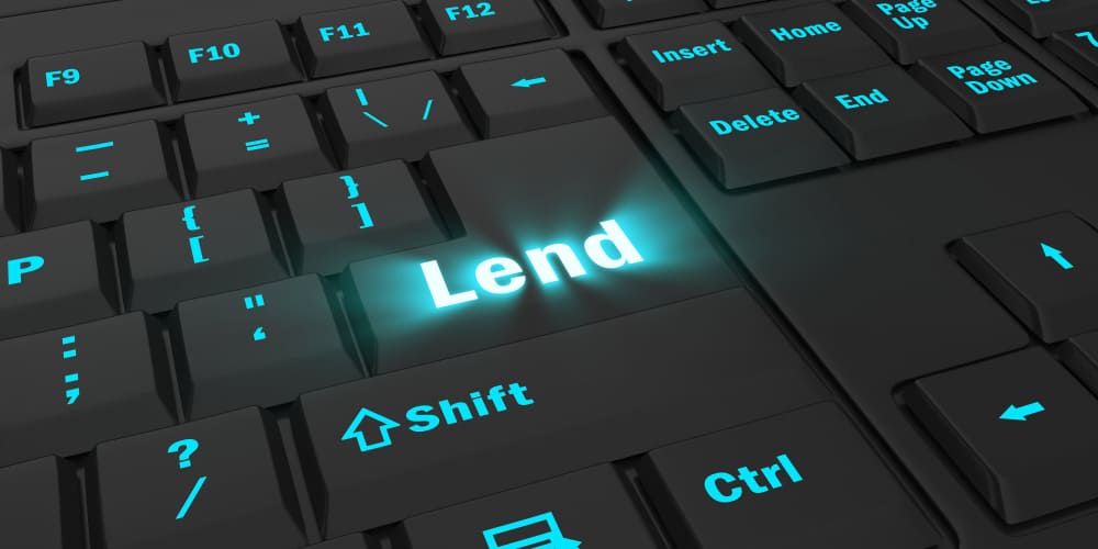 A lender using a computer to research “what is digital lending?