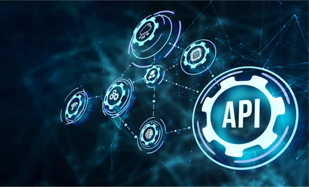 A graphical representation of Open API banking, with several cogs in a digital chain representing the different functions that can be connected to an API. }}